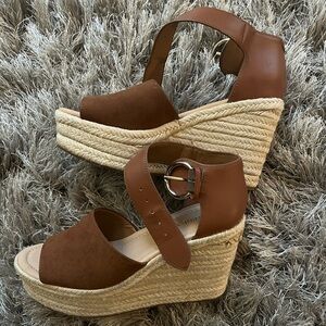 Nine West never worn (no tags or box) size 6 brown wedge sandals.